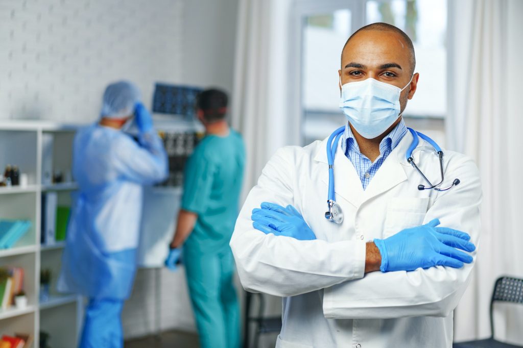 Portrait of african american doctor, hospital background